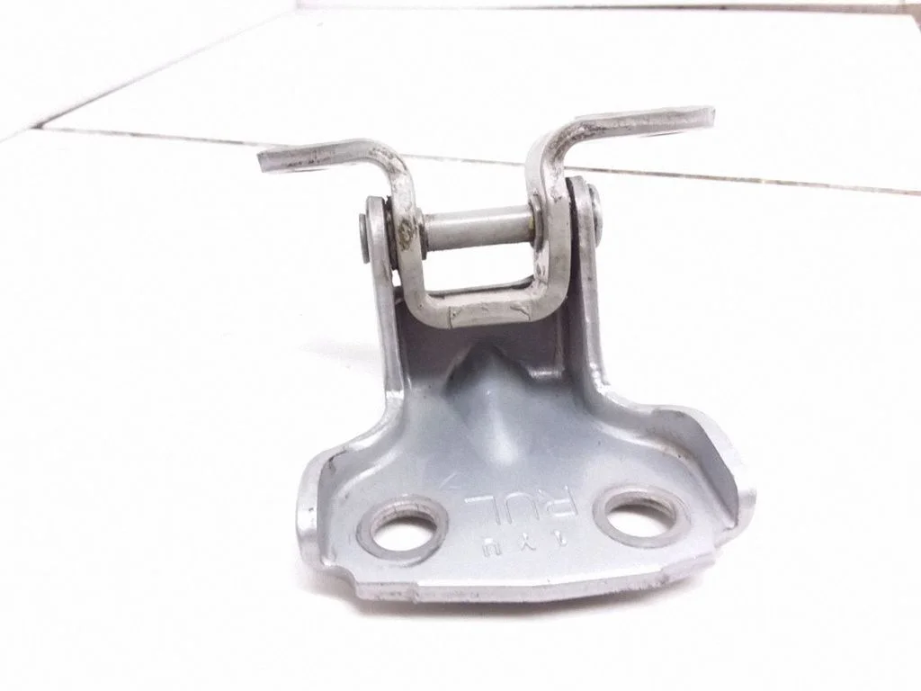 Rear door upper hinge – left