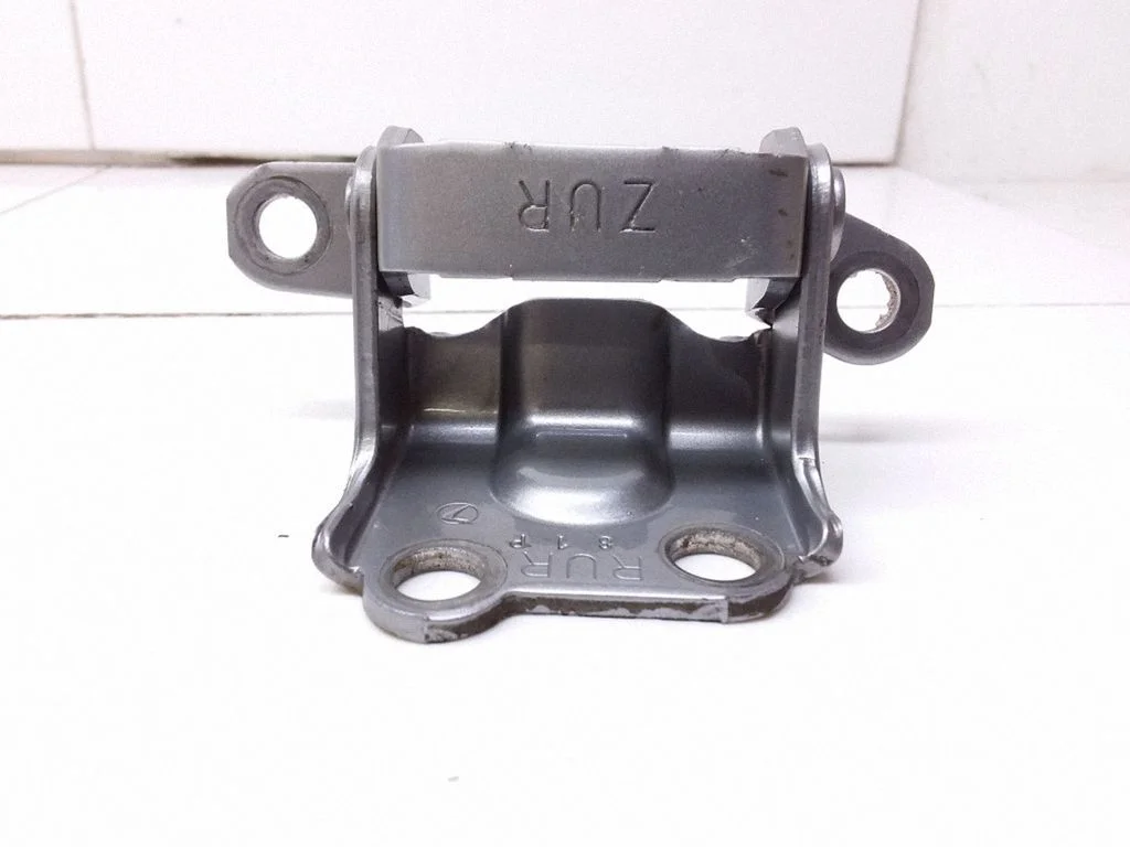 Rear door upper hinge