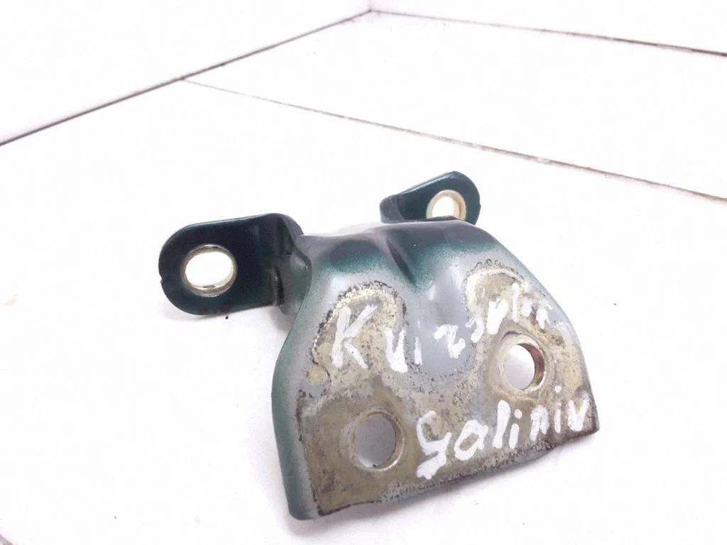 Rear door upper hinge – left