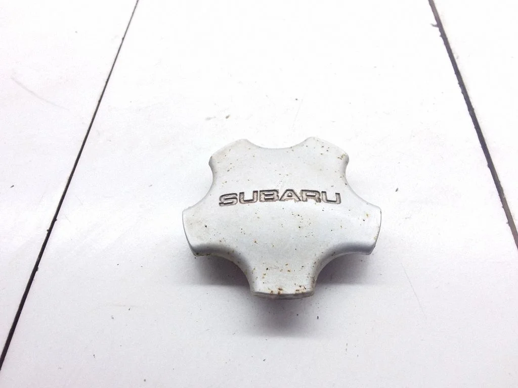 Oriģināls riteņa rumbas vāciņš (-i) – Subaru Legacy (1999-2003)