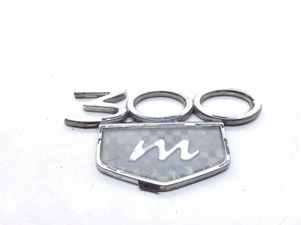 Manufacturers badge/model letters