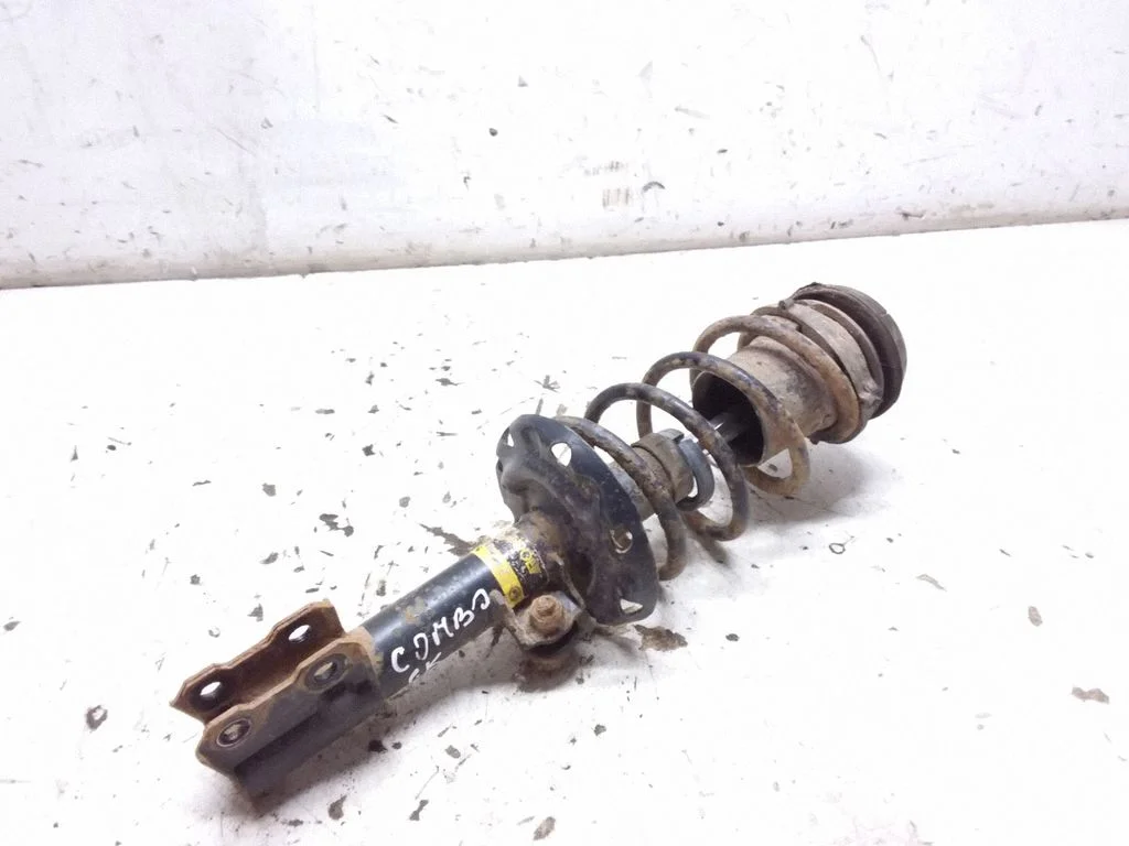 Front shock absorber with coil spring – Opel Combo C (2001-2011), front left