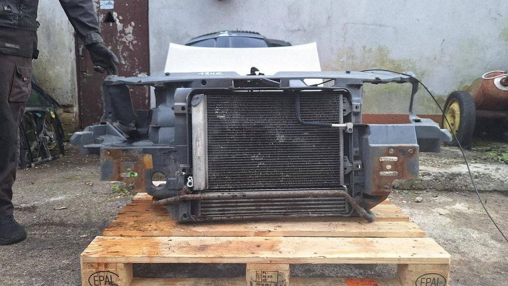 Radiator support slam panel