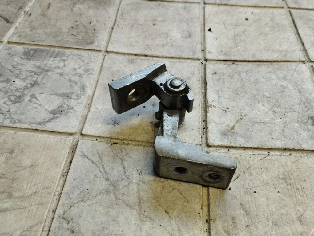 Rear door upper hinge – rear left