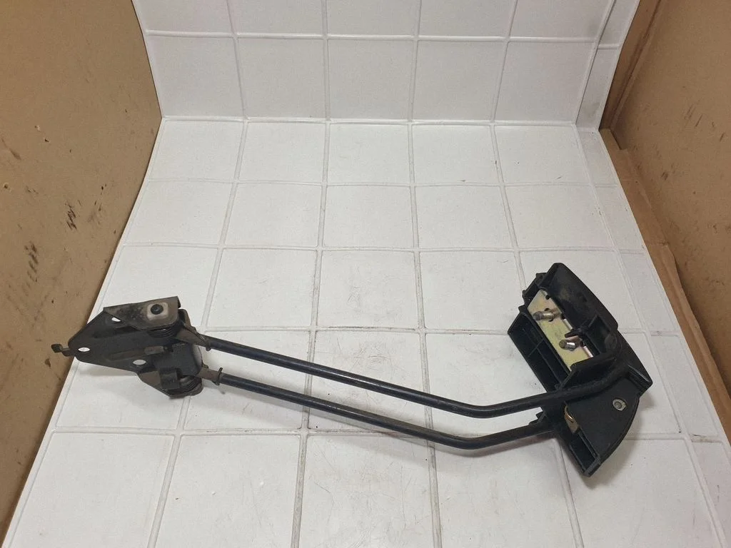 Rear door check strap stopper – rear left