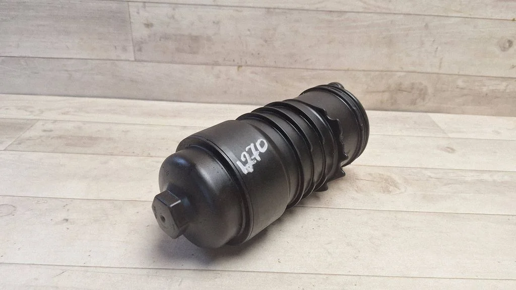 Oil filter mounting bracket 8558686