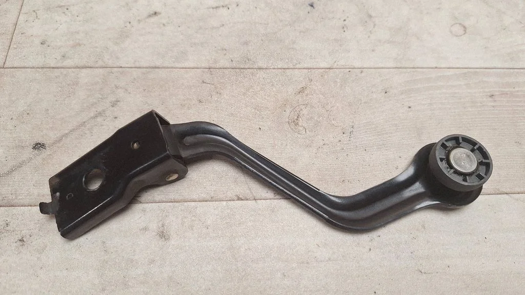 Sliding door upper roller guide/hinge