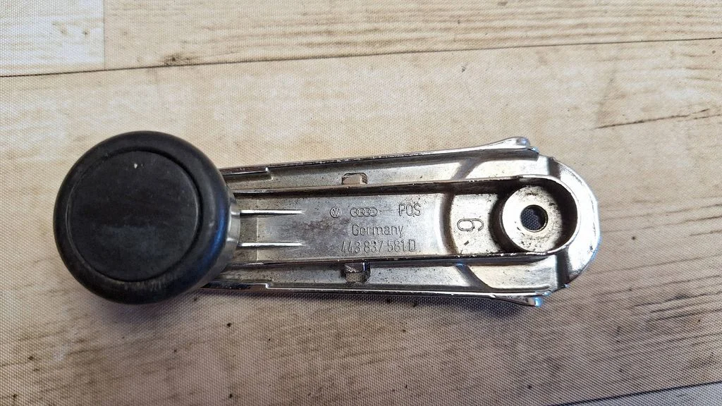 Front door window winding handle 443837581D