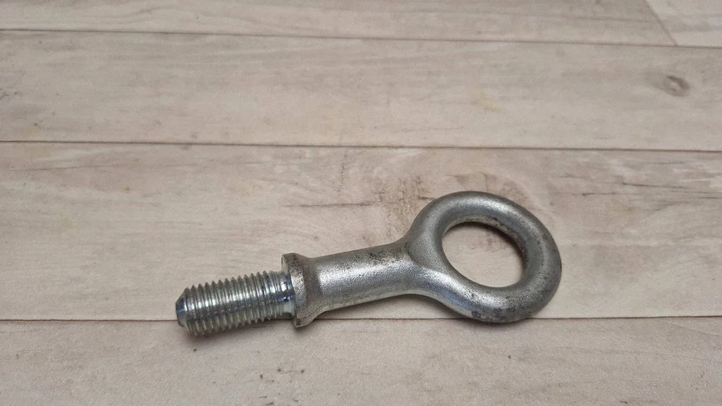 Towing hook eye