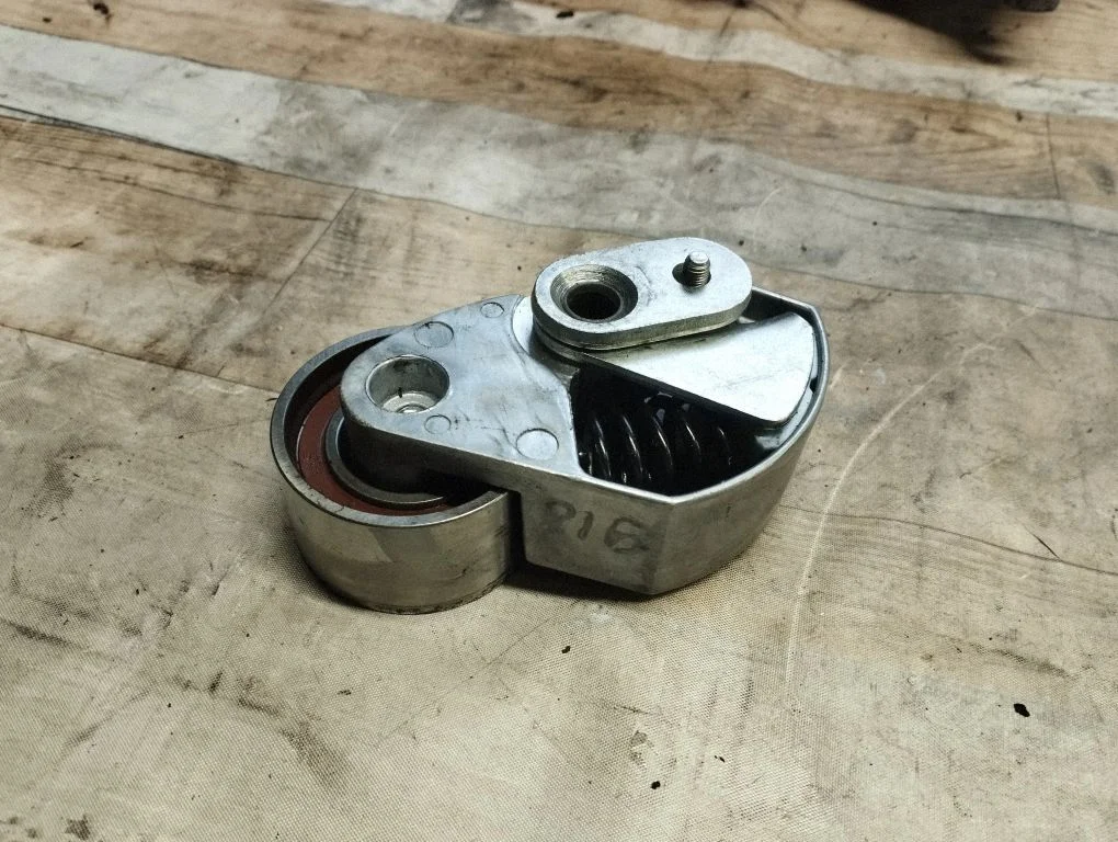 Timing belt/chain tensioner
