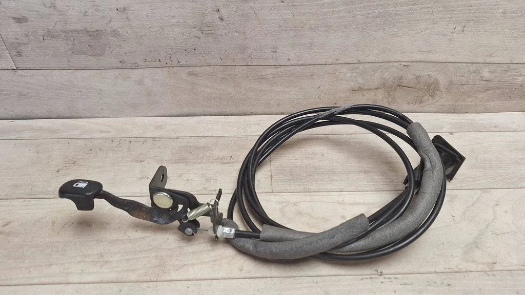 Fuel cap flap release cable