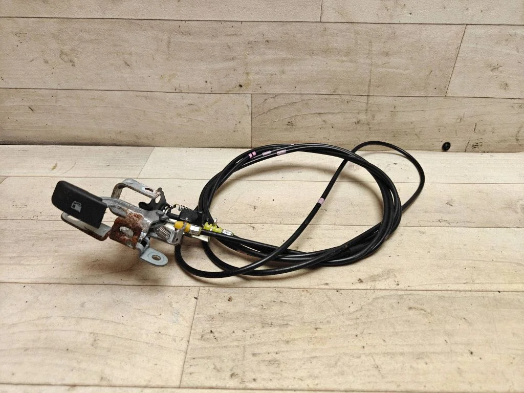 Fuel cap flap release cable
