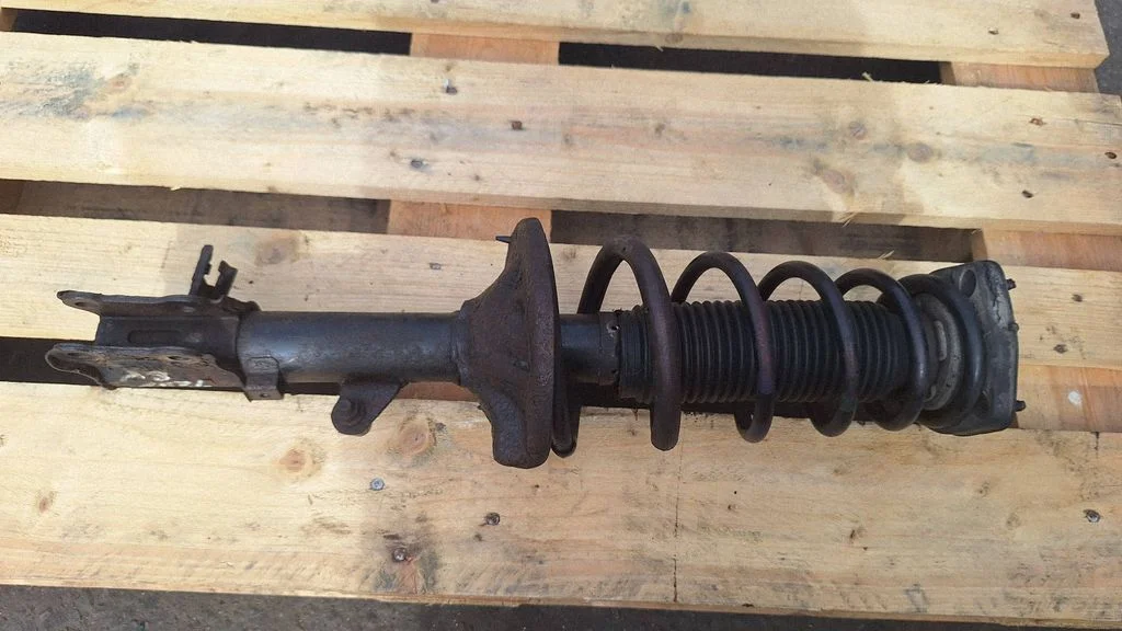 Rear shock absorber with coil spring – rear left