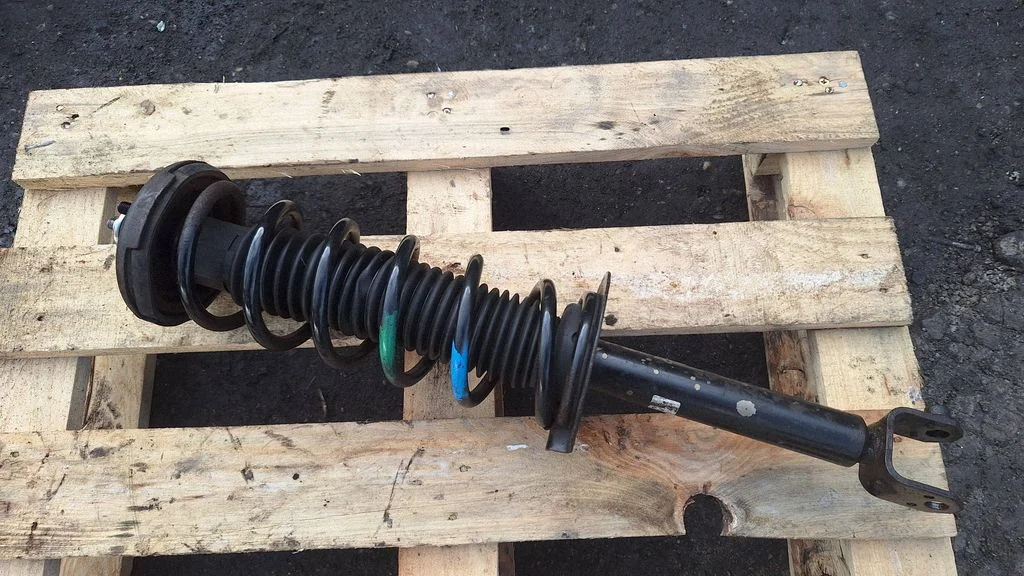 Rear shock absorber with coil spring – rear left