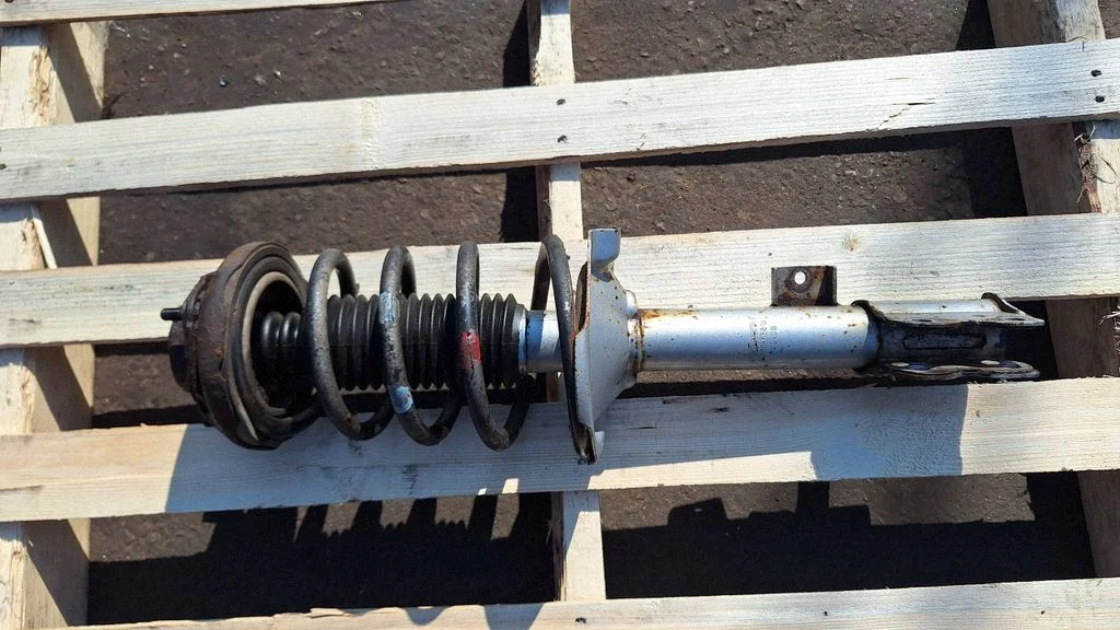 Rear shock absorber with coil spring – rear left