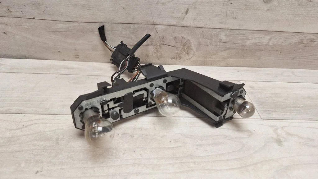 Tail light bulb cover holder 7M3945257