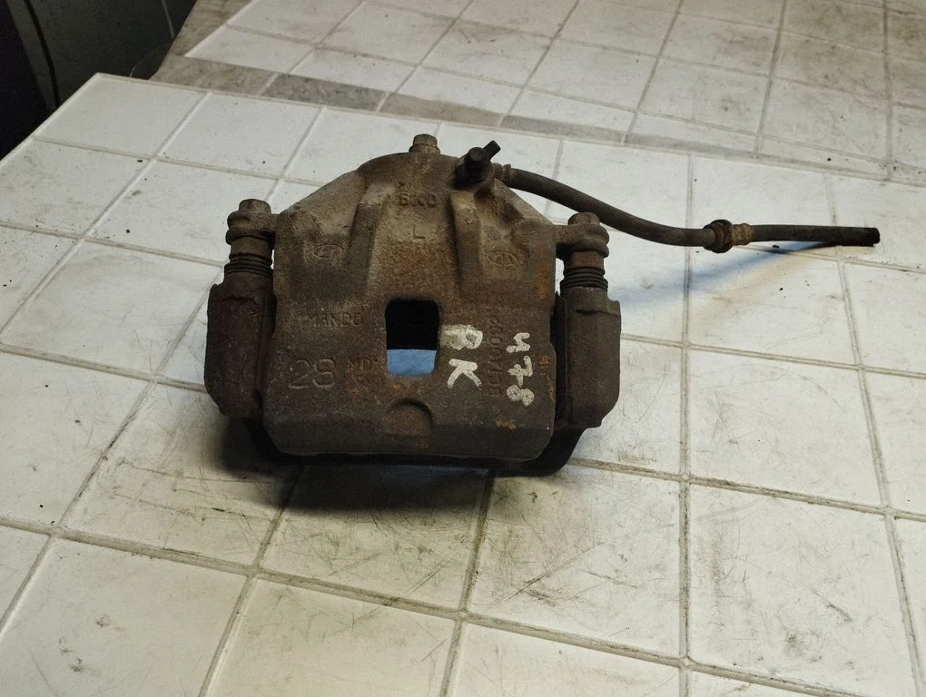 Front brake caliper – front left