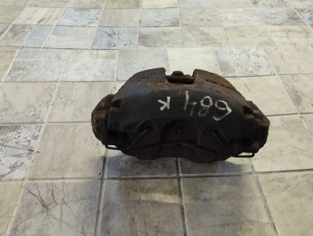 Front brake caliper – left