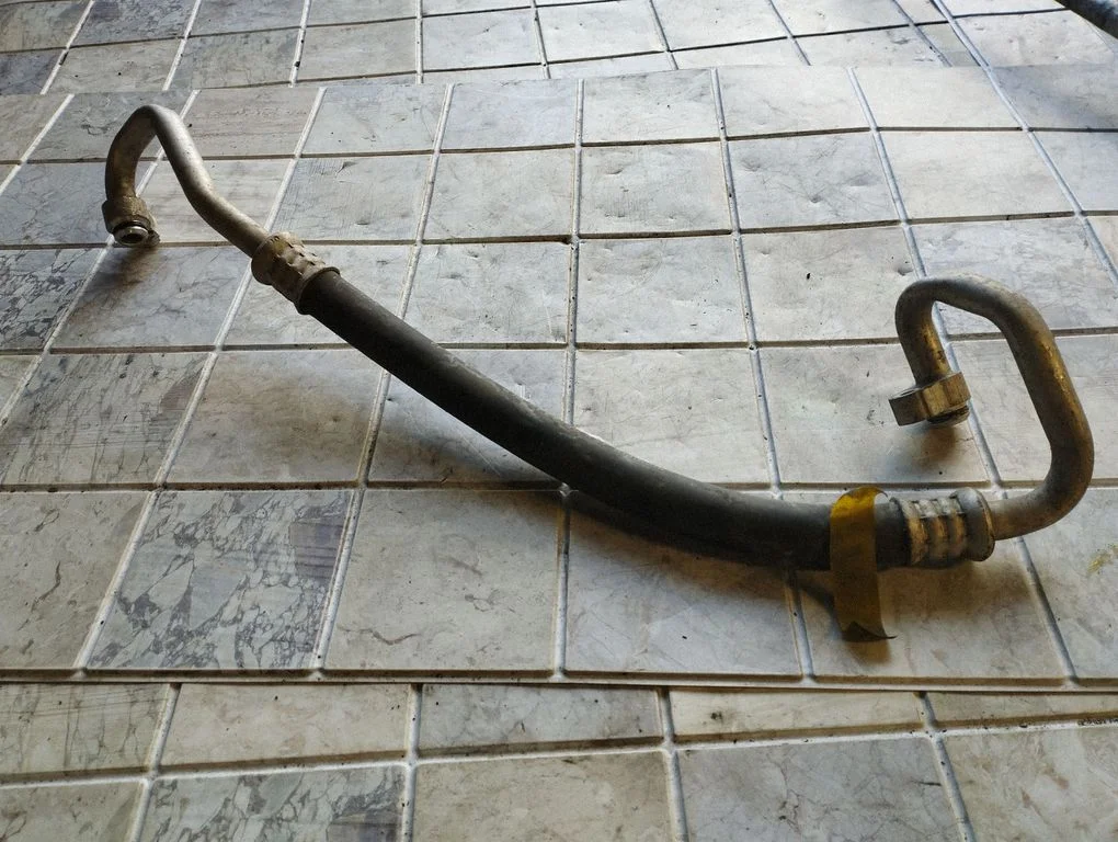 Air conditioning (A/C) pipe/hose – Toyota Yaris (2006-2011)