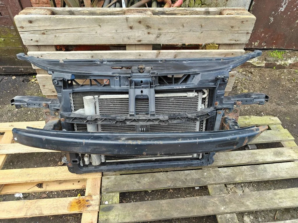 Radiator support slam panel