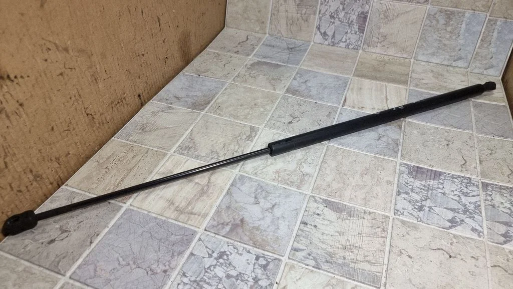 Front bonnet/hood damper/strut 12803213