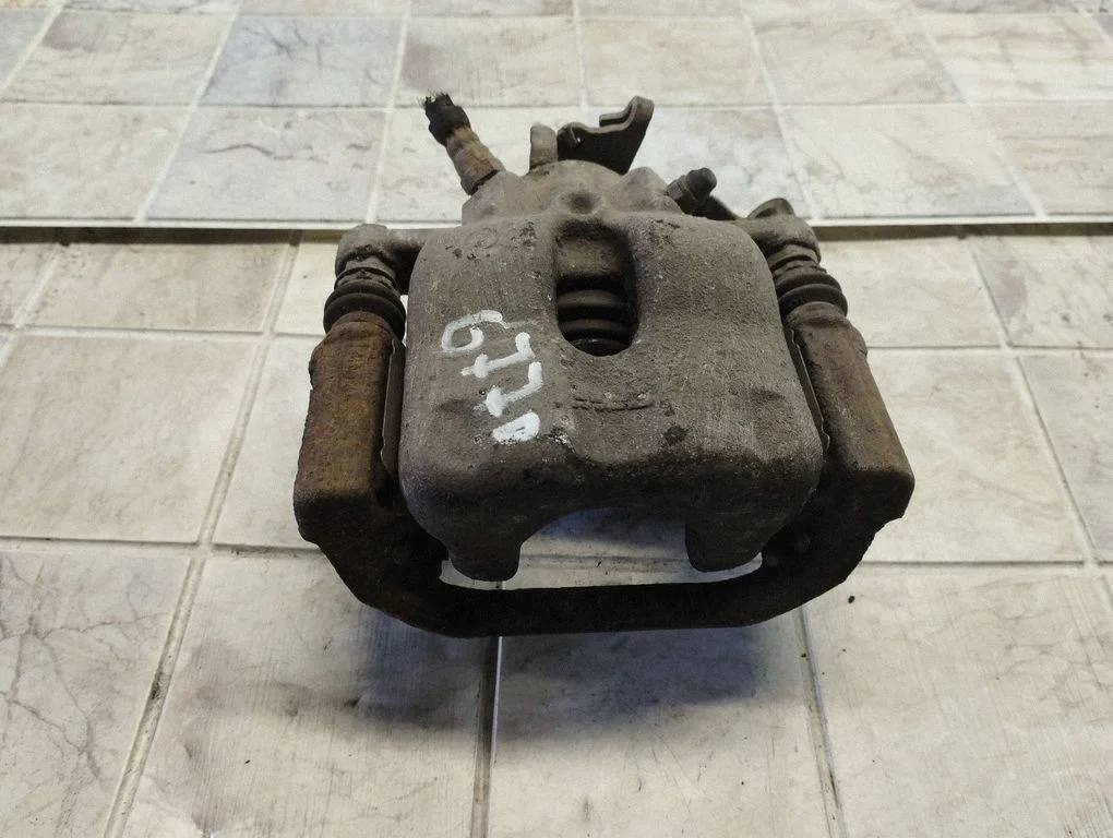 Rear brake caliper – right