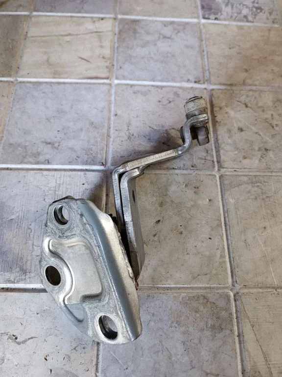 Front door upper hinge – rear right