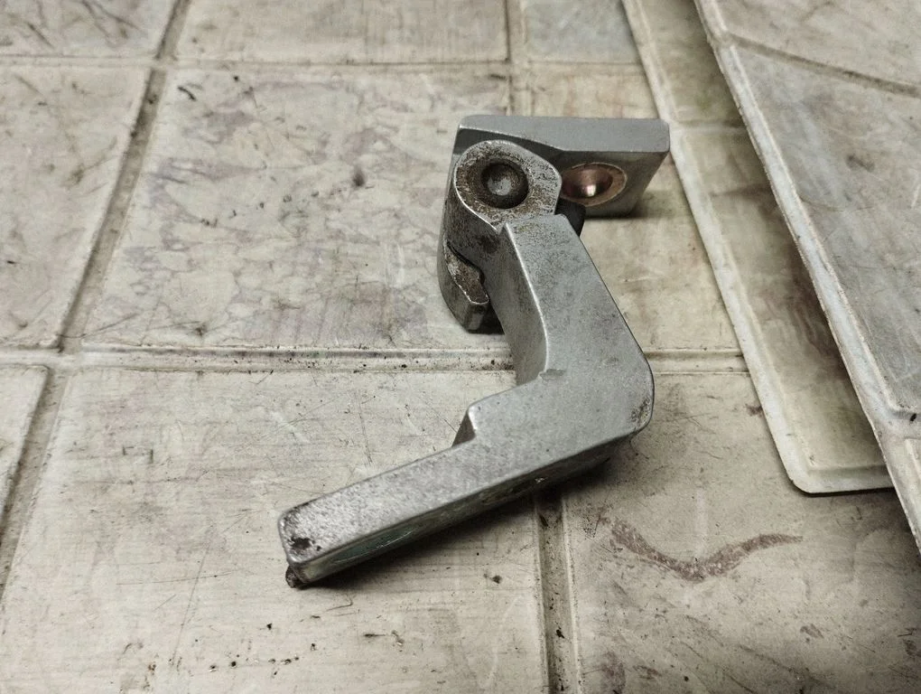 Front door upper hinge – front left