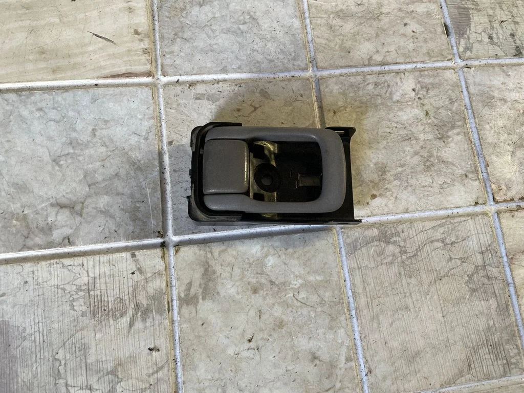 Front door interior handle – left