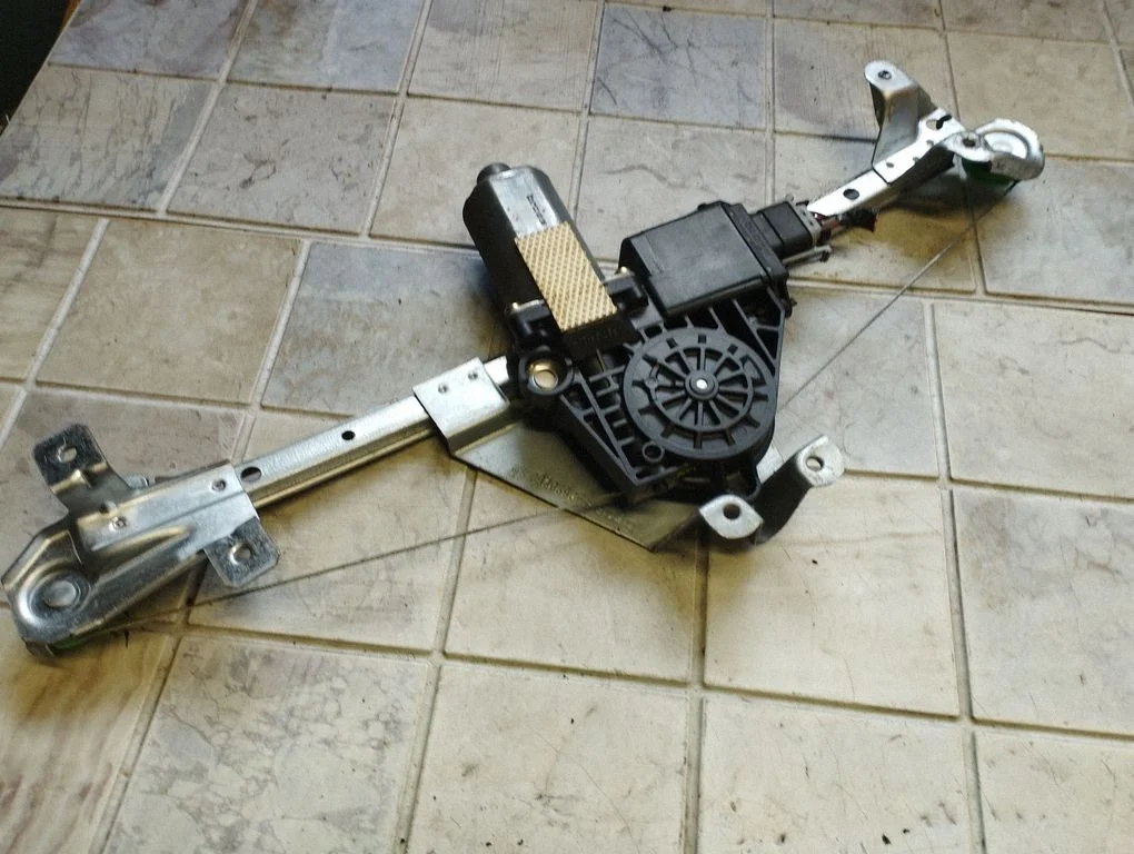 Rear door window regulator with motor 0130821788