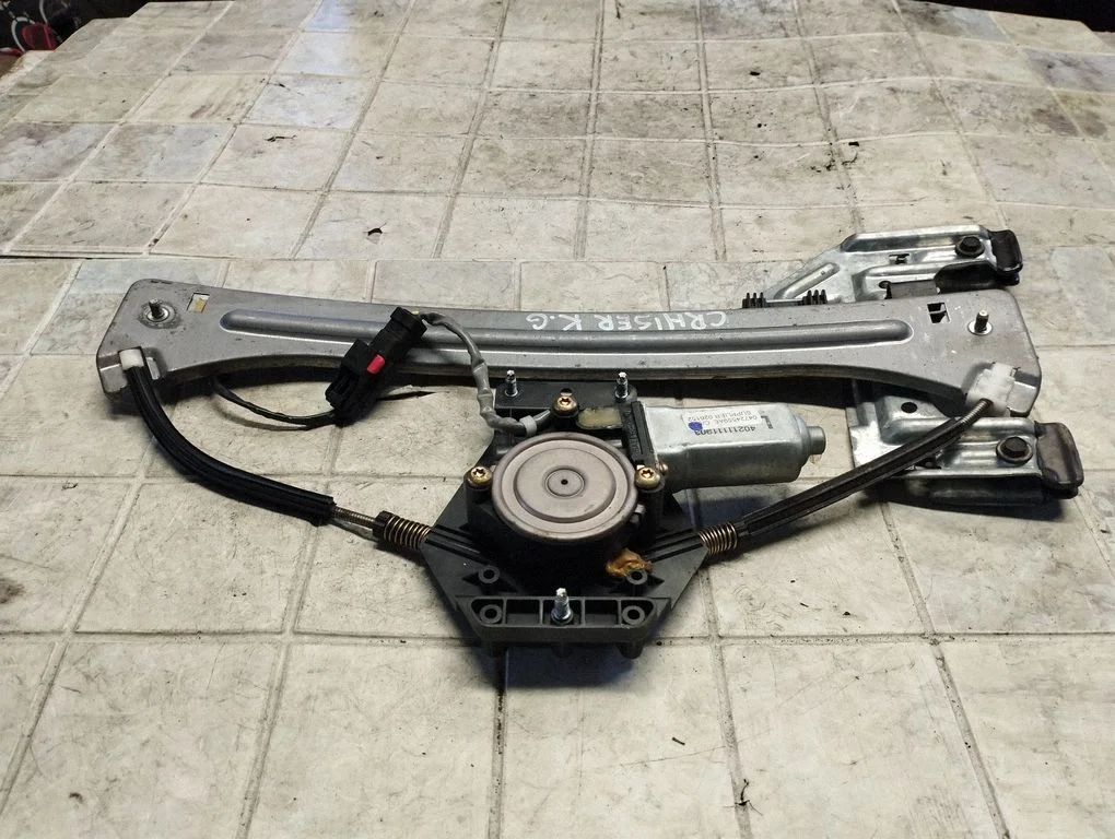 Rear door window regulator with motor