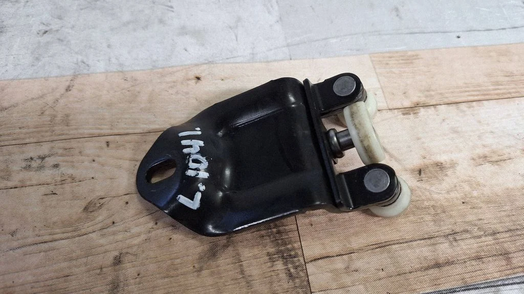 Sliding door upper roller guide/hinge – left
