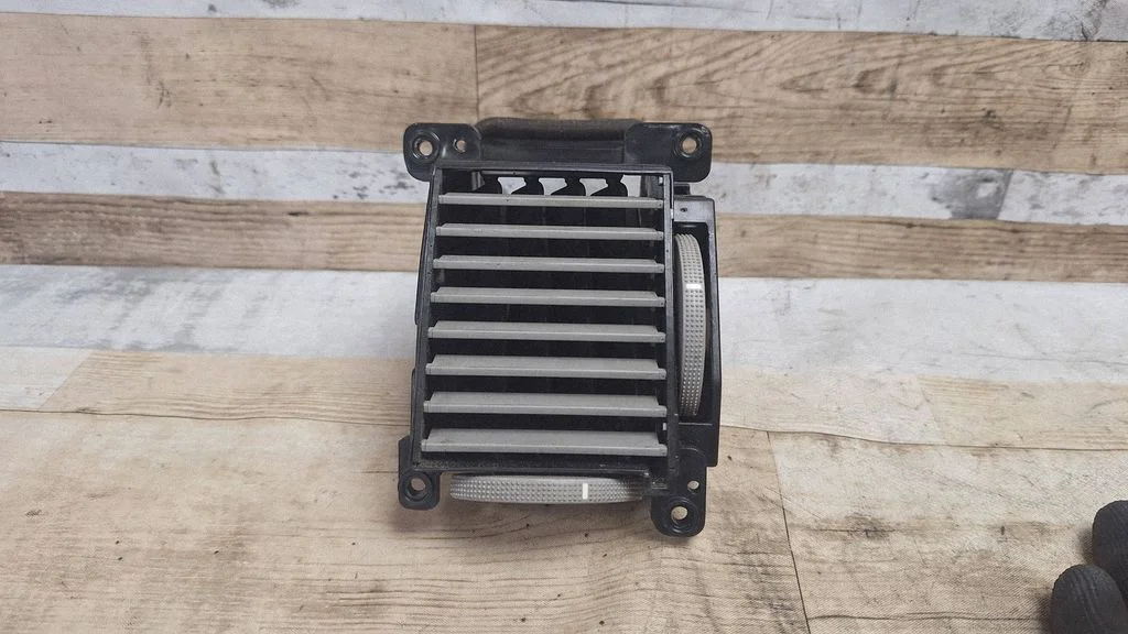 Dash center air vent grill 974203L000