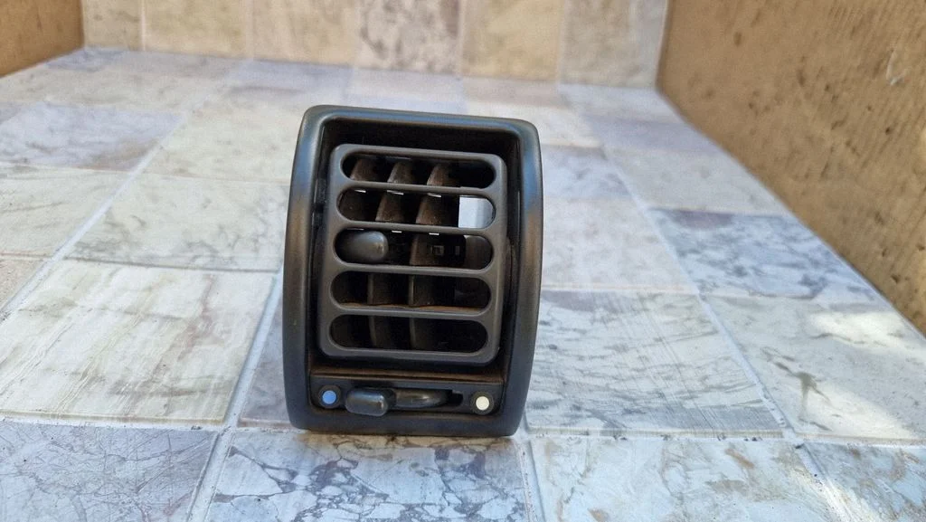 Dash center air vent grill