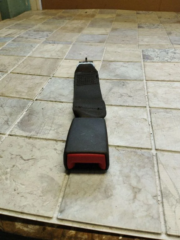 Rear seatbelt buckle 9119611
