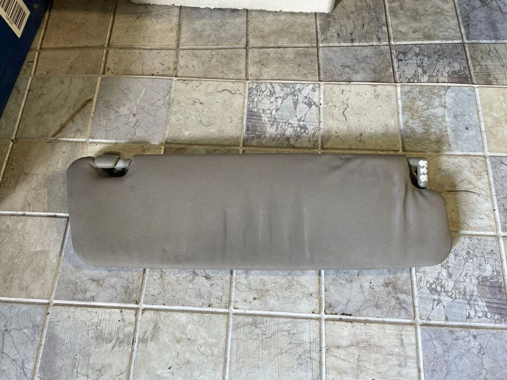 Sun visor – left