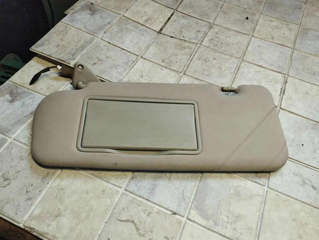 Sun visor – left