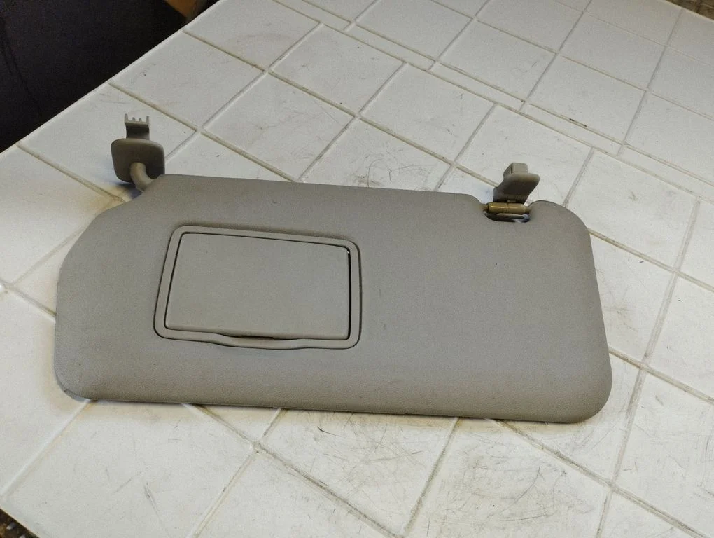 Sun visor – left