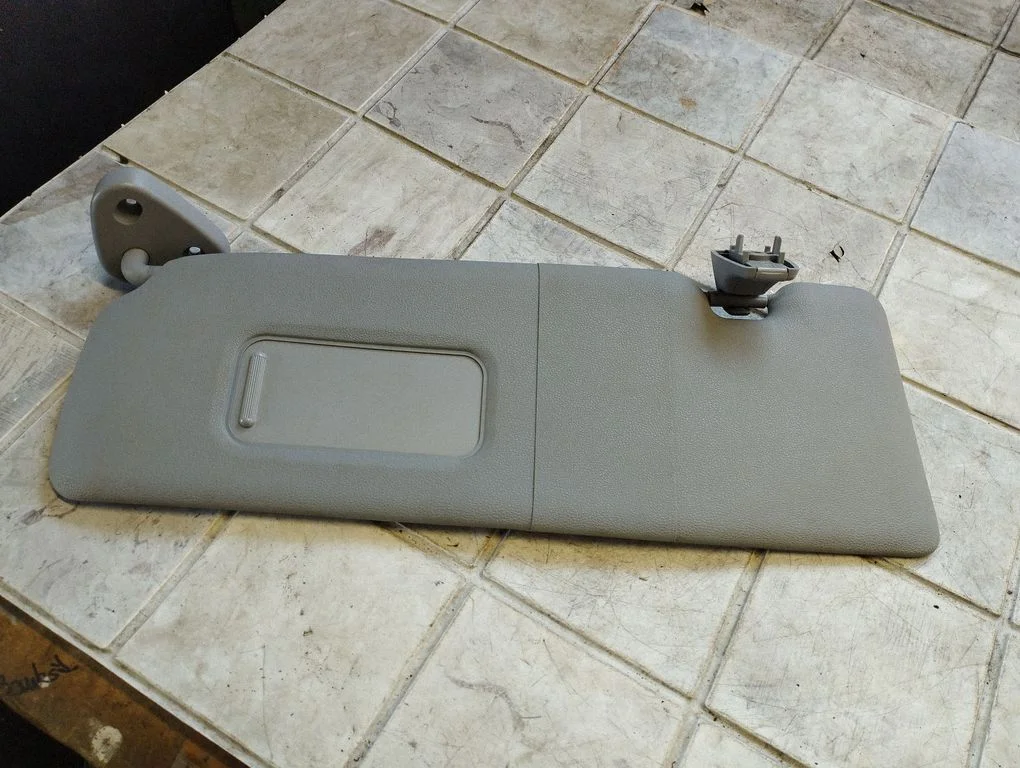Sun visor – left