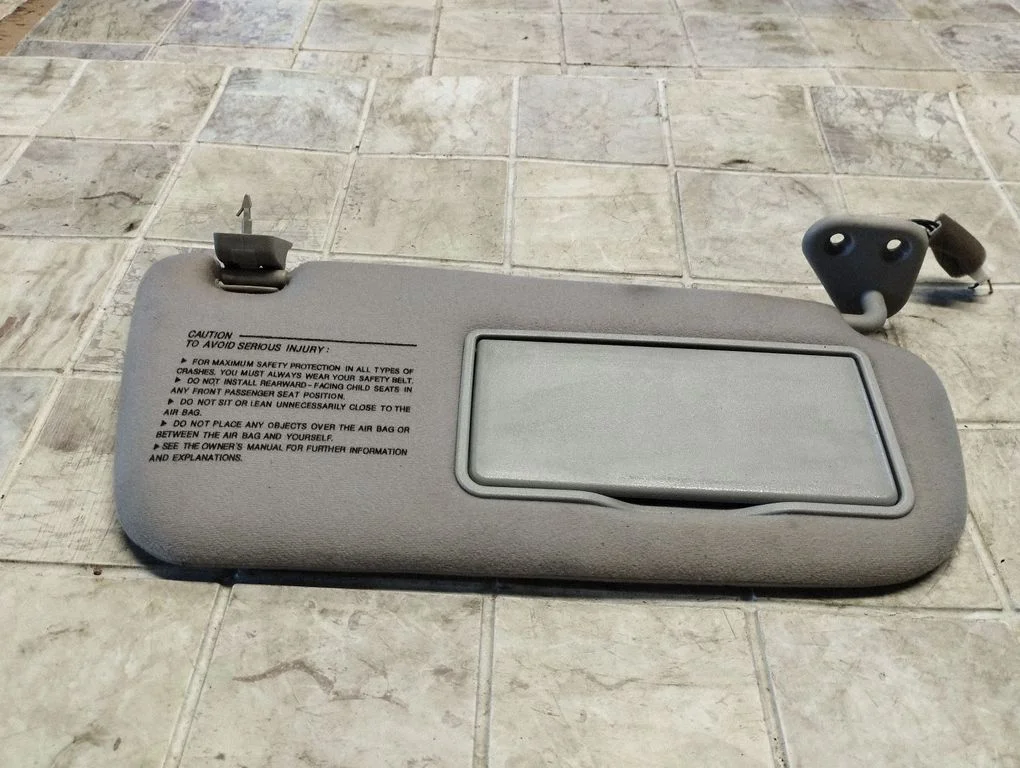 Sun visor – left