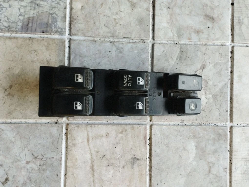 Electric window control switch – front left