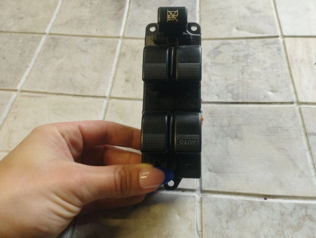 Electric window control switch – front left
