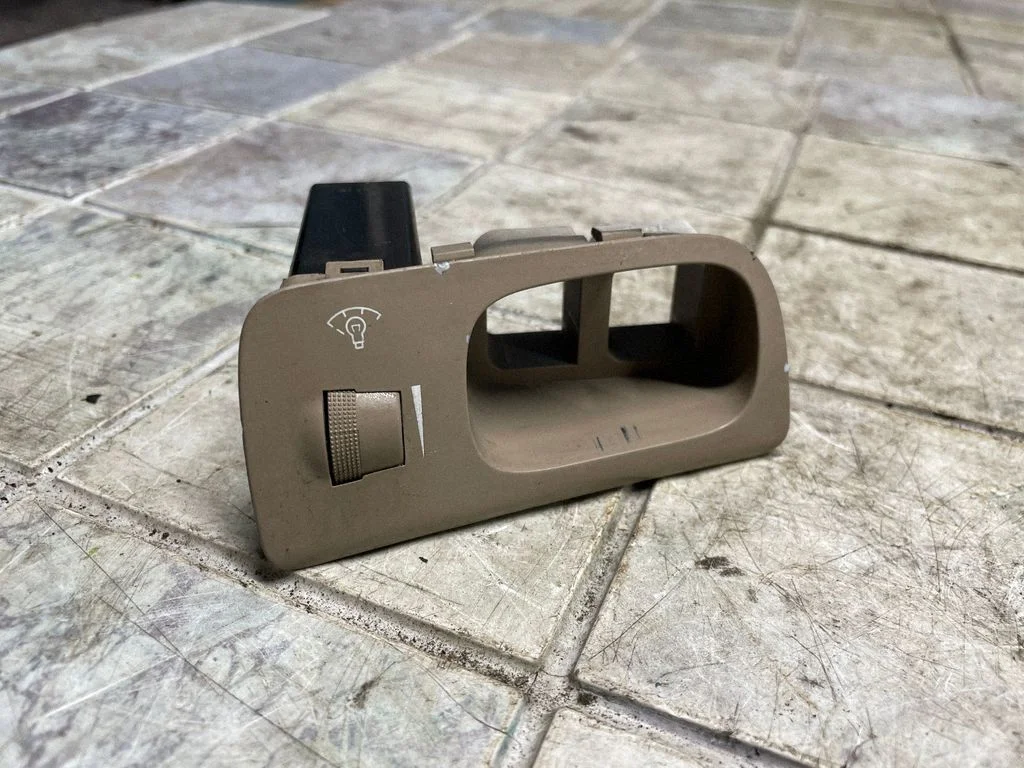 Headlight level height control switch