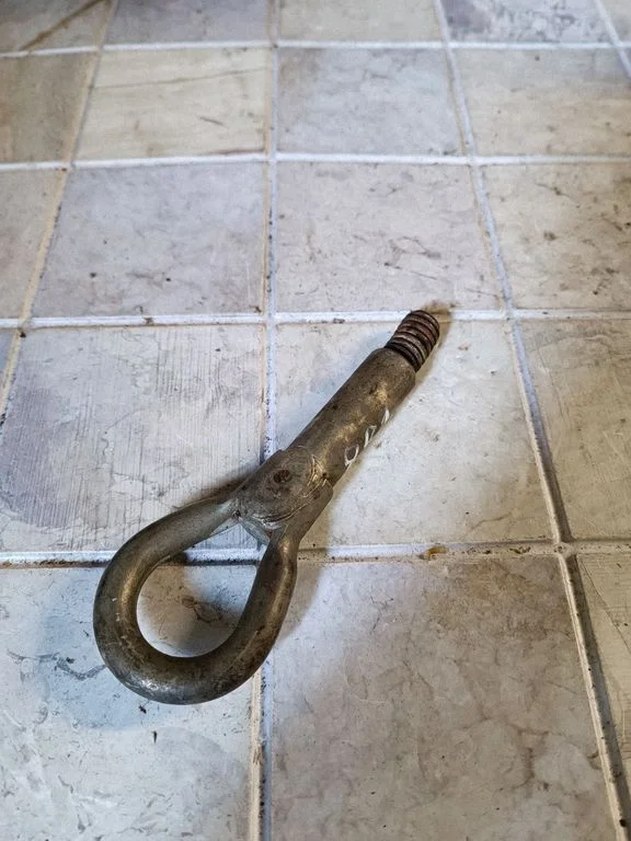 Towing hook eye