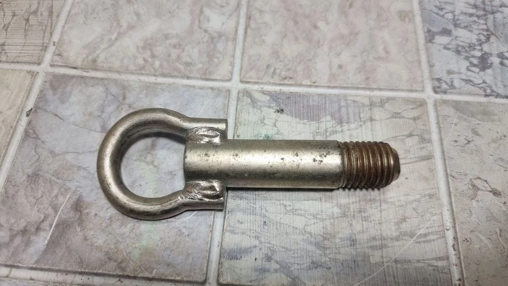 Towing hook eye