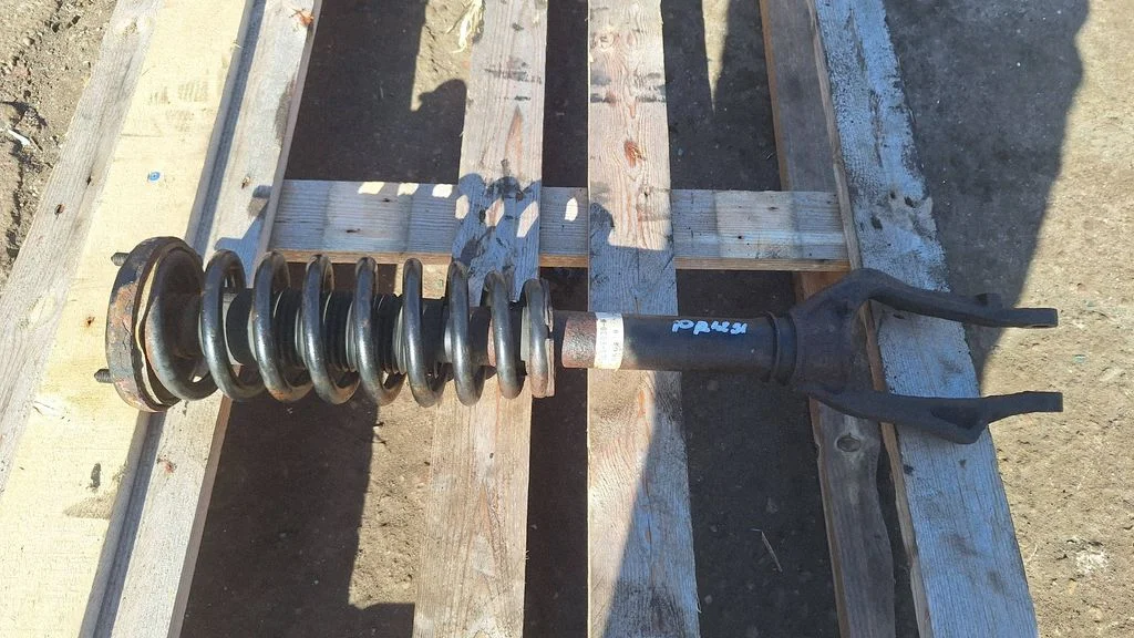 Front shock absorber with coil spring – front right
