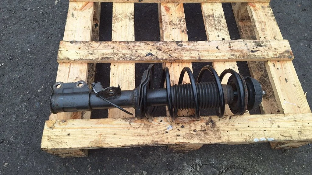 Front shock absorber with coil spring – front right