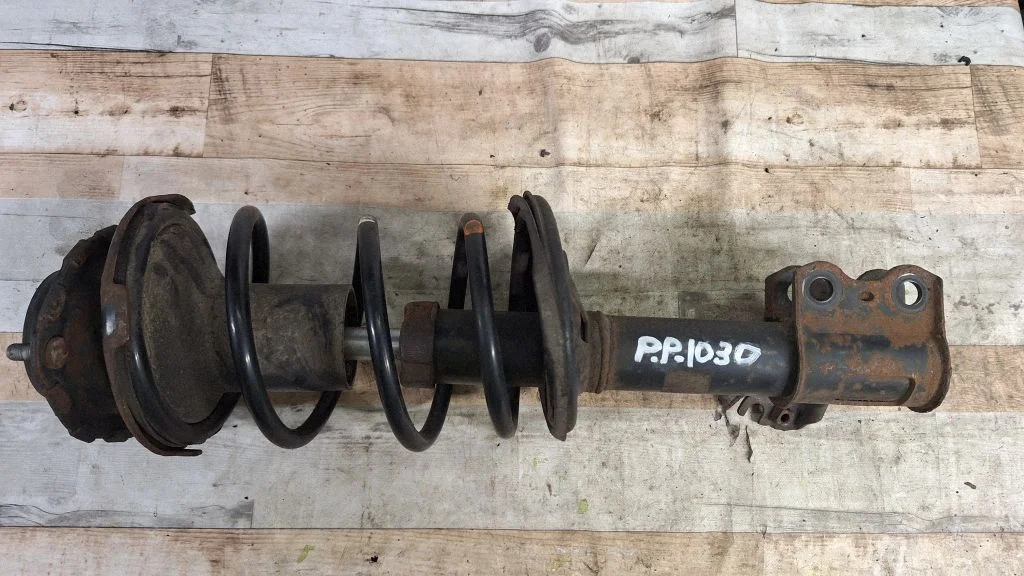 Front shock absorber with coil spring – front right