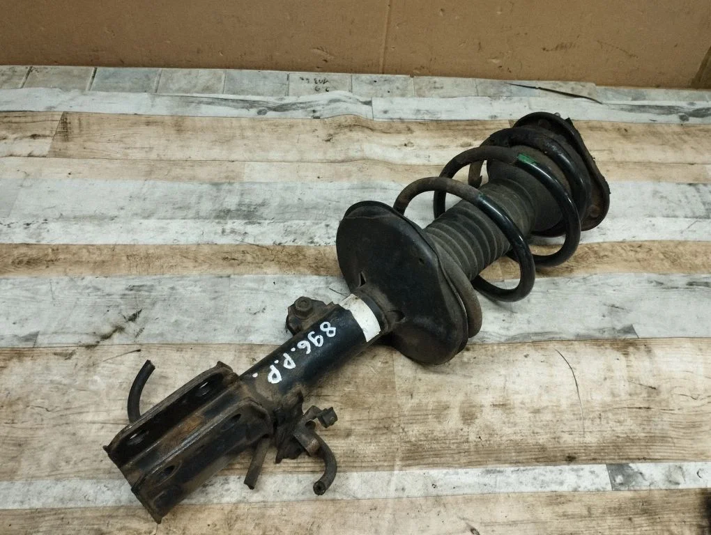 Front shock absorber with coil spring – front right