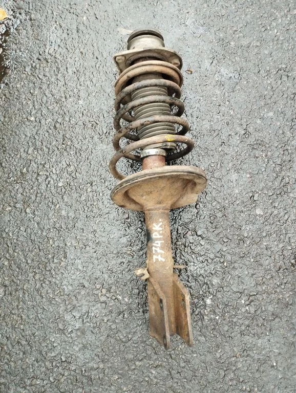 Front shock absorber with coil spring – left